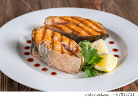 Grilled steaks of Arctic char 67036731