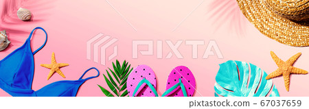 Summer concept with straw hat and swimwear Summer concept with straw hat and swimwear 67037659