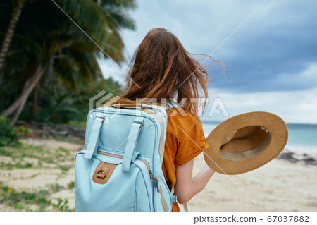 Woman tourist walk travel backpack Woman tourist walk travel backpack 67037882