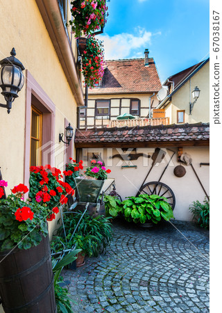 Traditional french houses and shops in Eguisheim, 67038167