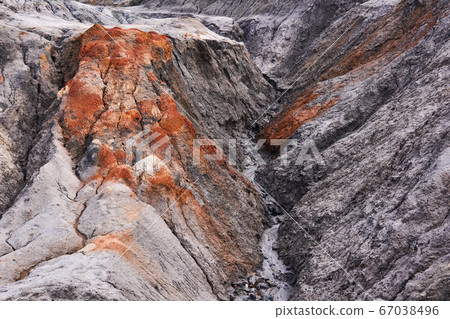 gully in a clay slope devoid of soil gully in a clay slope devoid of soil 67038496
