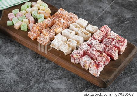 Turkish delight lokum on the wooden board 67039568