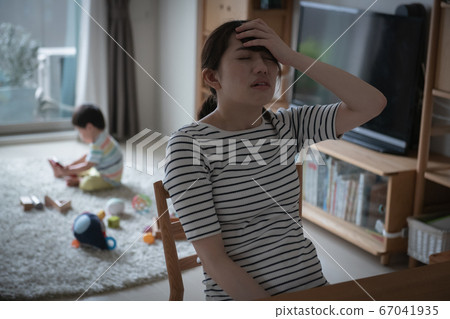 One-op image of a lonely Japanese woman suffering from childcare/childcare stress 67041935