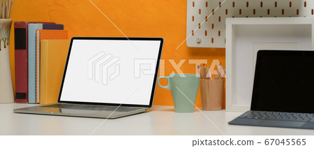 Mock-up laptop on creative office desk with Mock-up laptop on creative office desk with 67045565