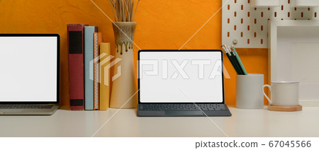 Blank screen tablet and laptop on creative home Blank screen tablet and laptop on creative home 67045566