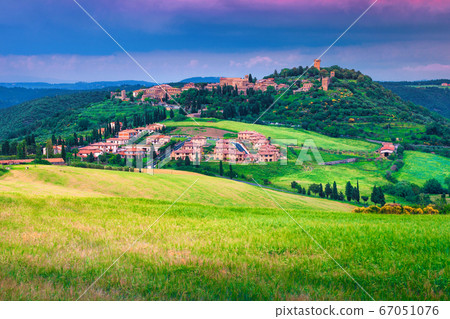 Picturesque Tuscany cityscape with grain fields, Monticchiello, Italy, Europe Picturesque Tuscany cityscape with grain fields, Monticchiello, Italy, Europe 67051076