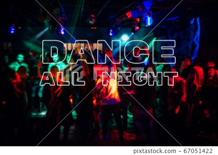 Inscription Dance all night on the background a blurred crowd of dancing people 67051422