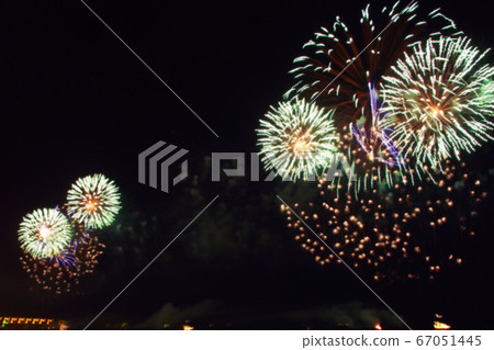 blurred multi-colored flashes of fireworks exploding blurred multi-colored flashes of fireworks exploding 67051445