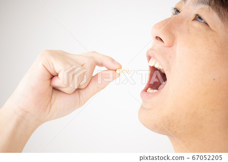 Young men drinking supplements Young men drinking supplements 67052205