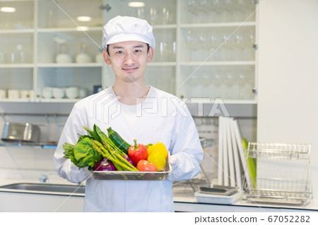 Male cook with vegetables Male cook with vegetables 67052282