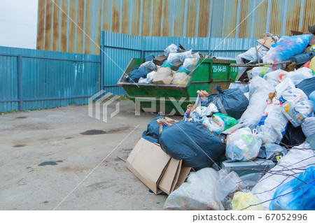 pile of waste in a container. garbage collapse. Janitors ' strike. environmental disaster of plastic recycling 67052996