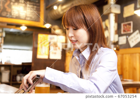 Woman grilling meat Woman grilling meat 67053254