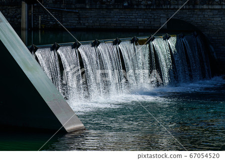 A small dam in a country in northern Italy A small dam in a country in northern Italy 67054520