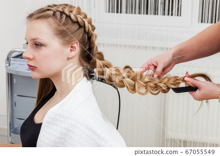 weave braid girl in hair salon 67055549