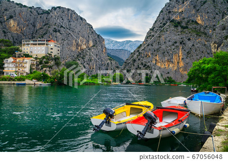 Omis fishing harbor with boats and high mountains, Dalmatia, Croatia Omis fishing harbor with boats and high mountains, Dalmatia, Croatia 67056048