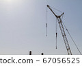 Construction crane on the background of the blue sky 67056525