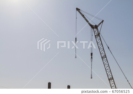 Construction crane on the background of the blue sky 67056525