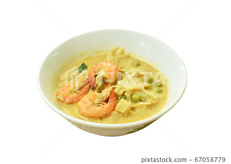 spicy boiled slice pickled bamboo shoot with shrimp and eggplant in coconut milk curry soup on bowl 67058779