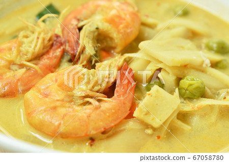 spicy boiled slice pickled bamboo shoot with shrimp and eggplant in coconut milk curry soup on bowl spicy boiled slice pickled bamboo shoot with shrimp and eggplant in coconut milk curry soup on bowl 67058780