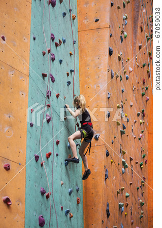 little girl climbing up the wall little girl climbing up the wall 67059038