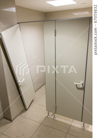The public toilet with the devastated door of the 67059832