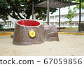 Stump-shaped playground equipment in the park 67059856