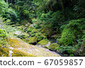 River flowing in the valley 67059857