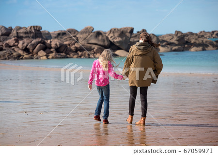 the sisters  on the shore of the ocean 67059971