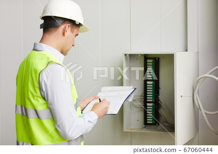 Engineer checking the data Engineer checking the data 67060444