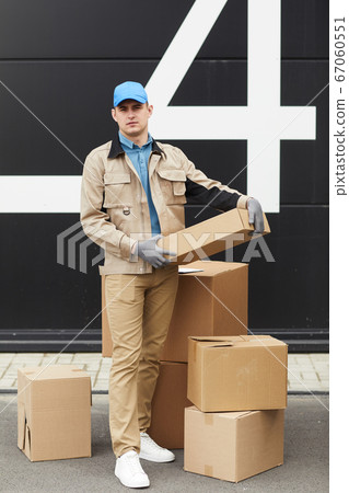Courier working with parcels in warehouse Courier working with parcels in warehouse 67060551