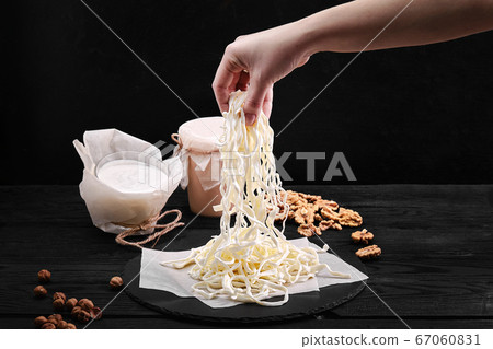 Cheese Chechil. Homemade soft cheese production. farm prodact Cheese Chechil. Homemade soft cheese production. farm prodact 67060831