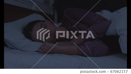Portrait of millennial woman sleeping in bed Portrait of millennial woman sleeping in bed 67062157