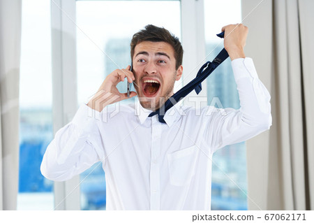 happy man in shirt hold tie in hand emotions model happy man in shirt hold tie in hand emotions model 67062171