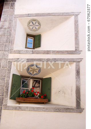 Small old-fashioned windows - Guarda village Engadine Switzerland Small old-fashioned windows - Guarda village Engadine Switzerland 67062877