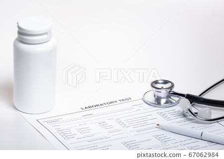 Form to fill of blood test, drug bottle and stetoscope 67062984