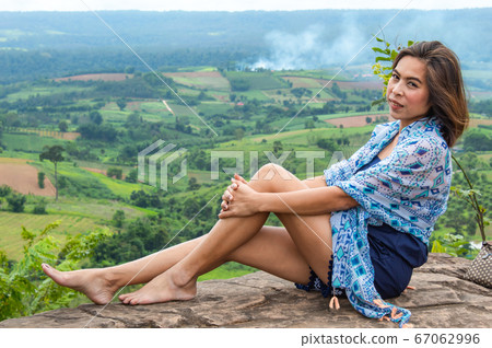 Portrait of Asian women and views of the mountains. 67062996