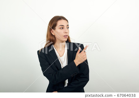 Hand pointer forefinger pointing on one side awry. Index finger show direction. 67064038