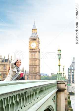 London woman happy by Big Ben 67064300