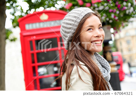 London people - woman by red phone booth London people - woman by red phone booth 67064321