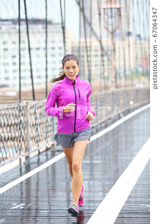 Running woman jogging in New York City Running woman jogging in New York City 67064347
