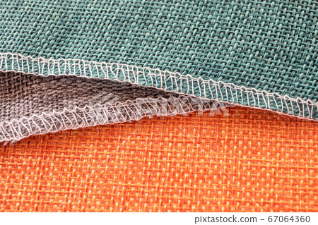 Orange, gray, green textiles. Fabric for decoration, embroidery 67064360