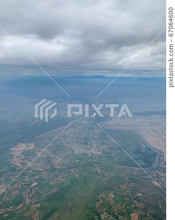 the view from the airplane, flying over the the view from the airplane, flying over the 67064600