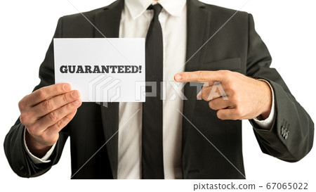 Closuep of businessman pointing to a white card Closuep of businessman pointing to a white card 67065022