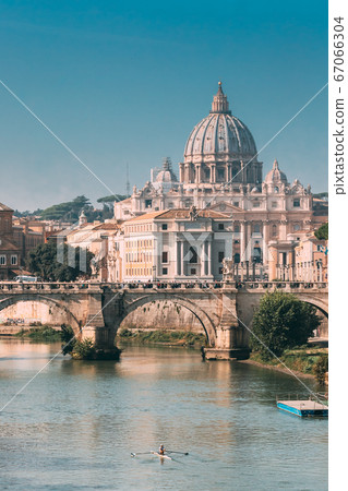 Rome, Italy. Man Training On Kayak Near Aelian Bridge. Papal Basilica Of St. Peter In The Vatican Rome, Italy. Man Training On Kayak Near Aelian Bridge. Papal Basilica Of St. Peter In The Vatican 67066304