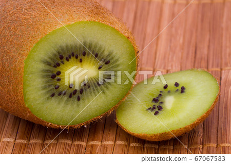 Kiwi fruit cutaway. Food macro shot. Kiwi fruit cutaway. Food macro shot. 67067583