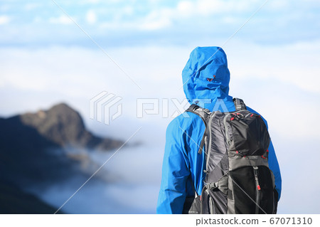 Hiker looking at view 67071310