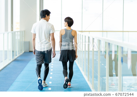 Rear view of a couple training in the gym Rear view of a couple training in the gym 67072544