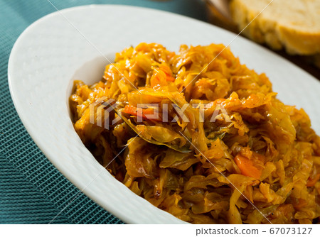 Plate of tasty stewed cabbage Plate of tasty stewed cabbage 67073127