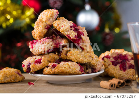 Christmas oat cookies on plate and glass of tea Christmas oat cookies on plate and glass of tea 67073287
