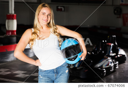 Woman standing near go-kart cars Woman standing near go-kart cars 67074006